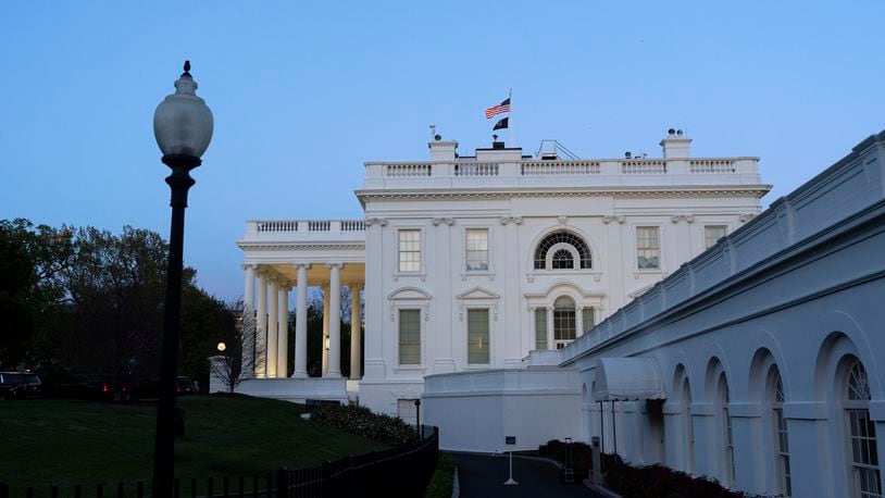 The White House is seen as dusk falls, Sunday, April 14, 2024, in Washington. (AP Photo/Jacquelyn Martin)