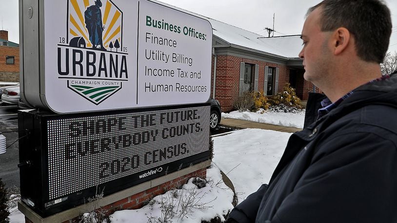 Doug Crabill, chairman of the Champaign County Census 2020 Complete Town Committee, looks over the LED sign in front of the Urbana Business Offices that reminds residents that everybody counts on the census. BILL LACKEY/STAFF