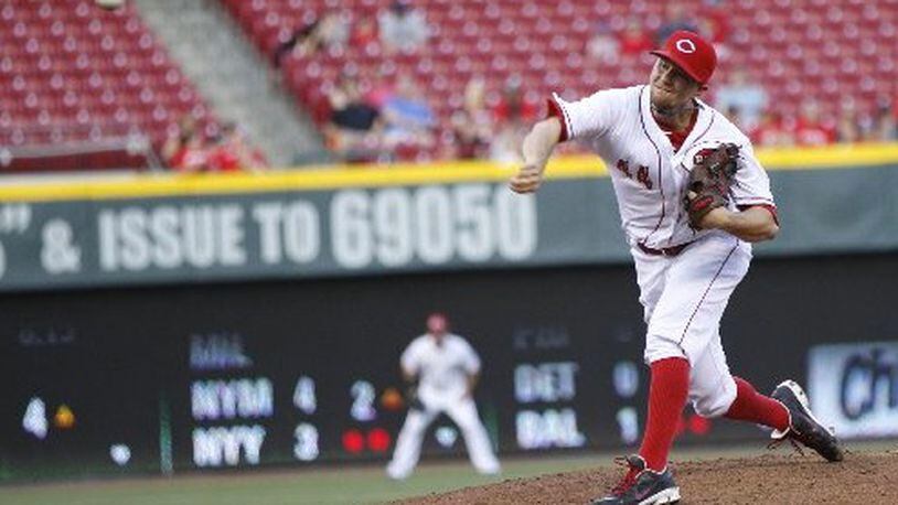 Reds starter Mike Leake pitches against the Padres on Tuesday, May 13, 2014, at Great American Ball Park in Cincinnati. David Jablonski/Staff