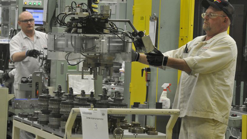 Honda associates work on the assembly line at the Honda Transmission Manufacturing plant in Russells Point in this 2013 file photo. Bill Lackey/Staff