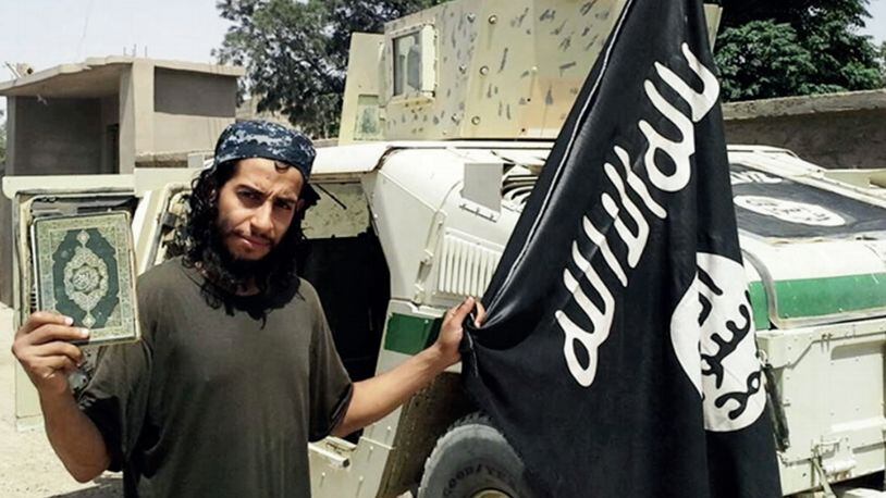This undated image made available in the Islamic State's English-language magazine Dabiq, shows Abdelhamid Abaaoud. Abaaoud, the child of Moroccan immigrants who grew up in the Belgian capital’s Molenbeek-Saint-Jean neighborhood, was identified by French authorities on Monday Nov. 16, 2015, as the presumed mastermind of the terror attacks last Friday in Paris that killed over a hundred people and injured hundreds more. (Militant Photo via AP)