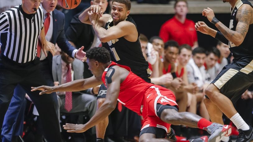 WEST LAFAYETTE, IN - FEBRUARY 07: P.J. Thompson #11 of the Purdue Boilermakers loses the ball as Jae’Sean Tate #1 of the Ohio State Buckeyes dives during the game at Mackey Arena on February 7, 2018 in West Lafayette, Indiana. (Photo by Michael Hickey/Getty Images)