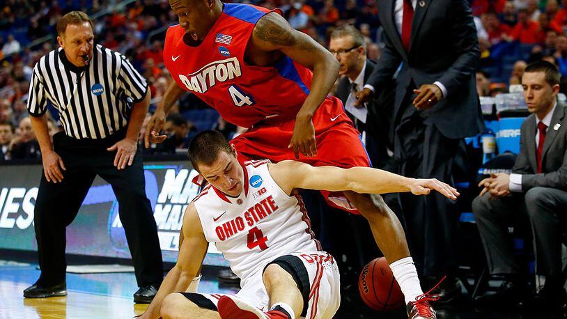 BUFFALO, NY - MARCH 20: Jordan Sibert #24 of the Dayton Flyers and Aaron Craft #4 of the Ohio State Buckeyes battle for a loose ball during the second round of the 2014 NCAA Men’s Basketball Tournament at the First Niagara Center on March 20, 2014 in Buffalo, New York. (Photo by Jared Wickerham/Getty Images)
