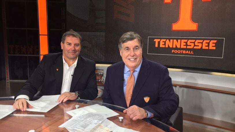 Brady Hoke (left) and Bob Kesling huddle together for the weekly University of Tennessee football call-in radio show Big Orange Hotline prior to the LSU game, the first of two contests that Hoke served as the Vols’ interim head coach during the 2017 season. CONTRIBUTED PHOTO