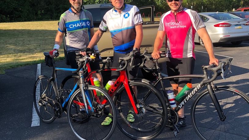 Larry Wiech, Craig Penney and Ryan Roll pose for a photo before their Pelatonia ride.