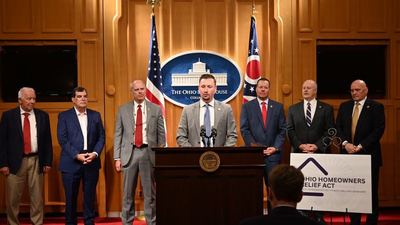 Ohio Rep. Thomas Hall announced the new Ohio Homeowners Relief Act at the statehouse on Wednesday. Pictured here are Rep. Bill Dean, Sen. George Lang, Rep. Adam Bird, Hall, Rep. Rodney Creech, Rep. Bill Roemer (chair of House Ways and Means Committee), and Rep. Tom Young