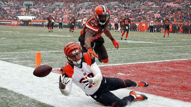 CLEVELAND, OH - DECEMBER 11: Alex Erickson #12 of the Cincinnati Bengals can’t make the catch against Briean Boddy-Calhoun #20 of the Cleveland Browns at Cleveland Browns Stadium on December 11, 2016 in Cleveland, Ohio. (Photo by Justin K. Aller/Getty Images)