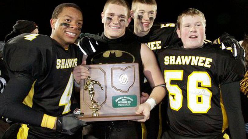 Shawnee players and coaches celebrate a 21-10 win over Jonathan Alder in Friday's Division III regional championship football game at Hilliard Bradley High School on Nov. 18, 2011. Shawnee advances to the state final four for the first time.