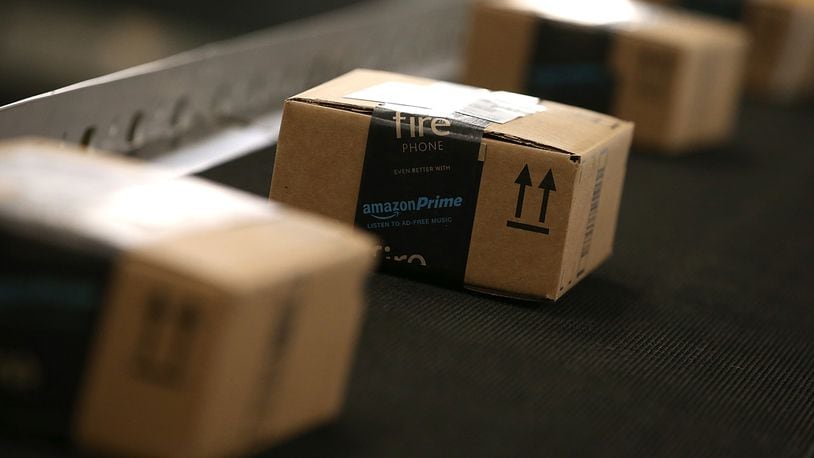 Boxes move along a conveyor belt at an Amazon fulfillment center on January 20, 2015 in Tracy, California.
