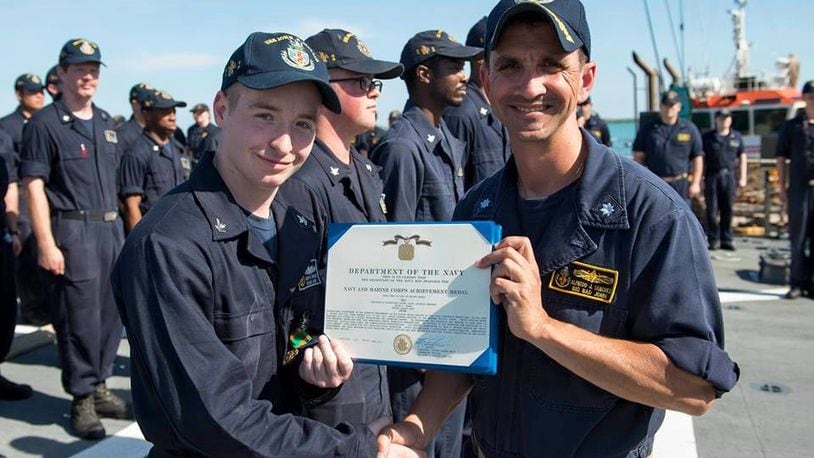 Electronics Technician 2nd Class Jacob Drake receives the Navy and Marine Corps Achievement Medal in July for his efforts during Mid-Cycle Inspection (MCI) aboard Arleigh Burke-class guided missile-class destroyer USS John S. McCain. Drake, a graduate of Triad High School, was among 10 sailors killed after a crash involving the USS McCain. Photo from U.S. Navy.