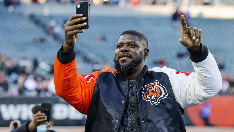 Former Cincinnati Bengal offensive lineman Willie Anderson stands on the field to cheer on the Cincinnati Bengals during the Super Bowl LVI Opening Night Fan Rally presented by Gatorade Monday, Feb. 7, 2022 at Paul Brown Stadium in Cincinnati. NICK GRAHAM/STAFF