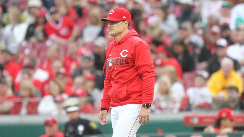 Reds manager David Bell walks to the mound to make a pitching change in the ninth inning on Opening Day on March 28, 2019, at Great American Ball Park in Cincinnati.