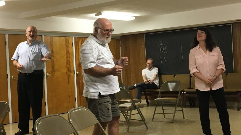 Steve Morgenstern, left, Don Bendure, Ryan Hester and Rebecca Baker rehearse for Springfield Civic Theatre’s upcoming production of the classic drama “Our Town.” CONTRIBUTED/BRETT TURNER