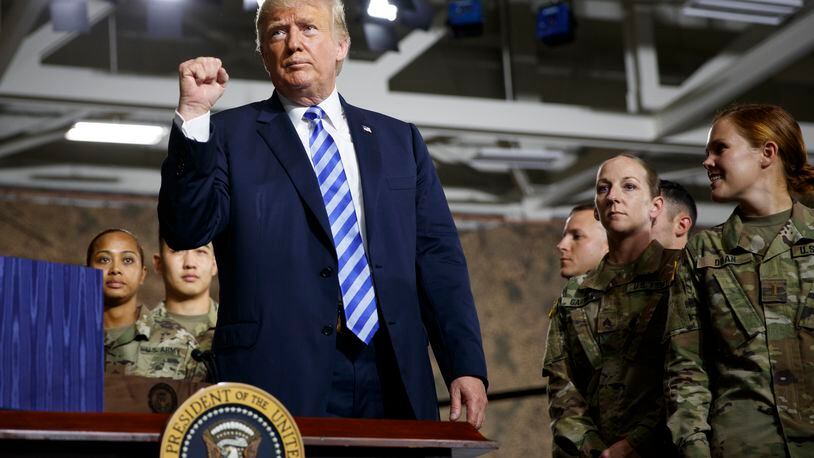 President Donald Trump delivers remarks during the signing ceremony for the John S. McCain National Defense Authorization Act at Wheeler-Sack Army Air Field in Fort Drum, N.Y., August 13, 2018. The president is later headlining a fundraiser for Rep. Claudia Tenney (R-N.Y.) in Utica. (Tom Brenner/The New York Times)