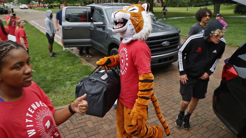 Wittenberg University’s phrase “Tiger Up” has now been trademarked by the college. In this photo, Ezry the Wittenberg Tiger mascot joined in earlier this year to help incoming freshmen move into the dorms during "Move-In Day" on campus. FILE/BILL LACKEY/STAFF