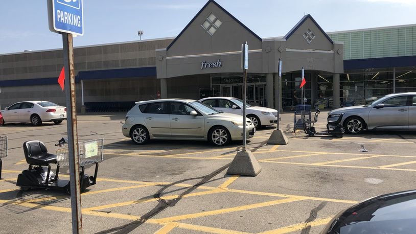 Three Atlanta-area people were arrested in the parking lot of this Meijer in Warren County with equipment used to skim credit cards and gift, bank and credit/debit cards, including one reported missing in 2017. The driver was also charged with parking in a handicapped spot. STAFF/LAWRENCE BUDD