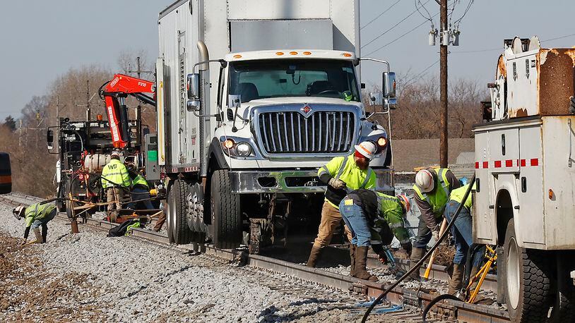 Workers are still cleaning up and repairing the railroad tracks Thursday, March 9, 2023 west of State Route 41 following Saturday's derailment. BILL LACKEY/STAFF