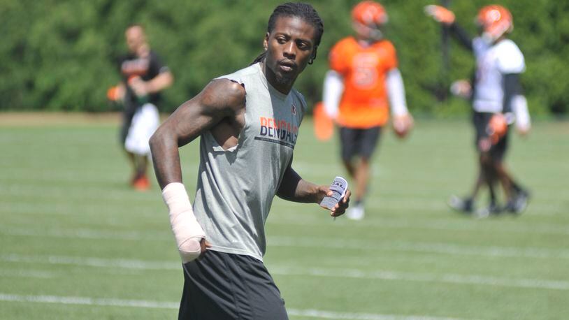 Cincinnati Bengals cornerback Dre Kirkpatrick, who recently fractured his right hand, runs through some mental reps during the team’s first OTA practice Tuesday. JAY MORRISON/STAFF
