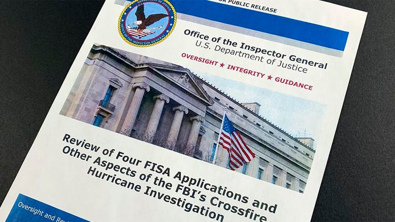 The cover page of the report issued by the Department of Justice inspector general is photographed in Washington, Monday, Dec. 9, 2019.