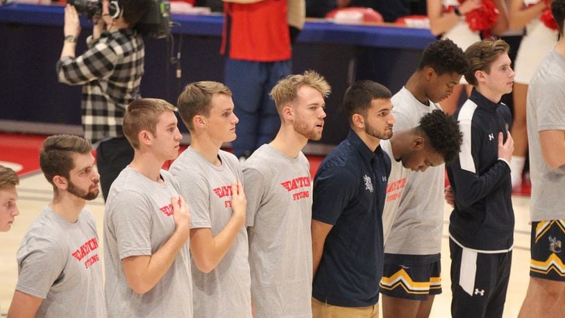 Cedarville players stand for the national anthem before an exhibition game against on Saturday, Nov. 2, 2019, at UD Arena. David Jablonski/Staff