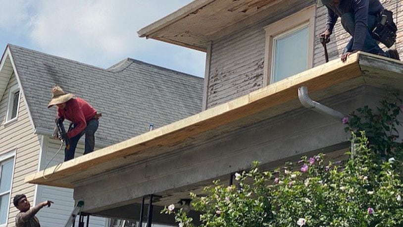 Workers with the Neighborhood Housing Partnership of Springfield helped to provide a new roof for a Springfield senior citizen on West State Street . The partnership will help coordinate a new program in Clark County geared toward emergency home repairs. CONTRIBUTED PHOTO