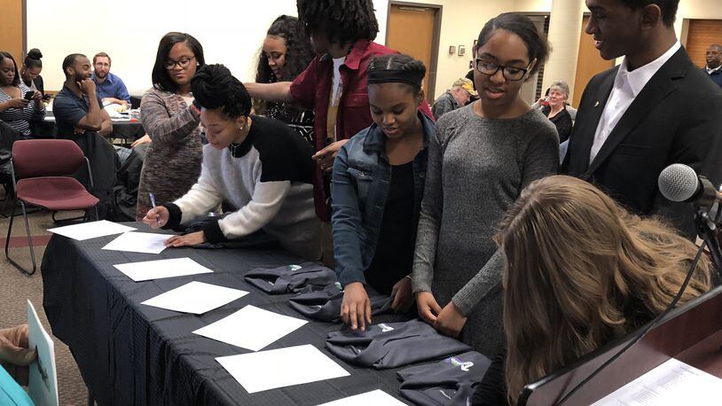 Eight area high school students signed contracts Friday to become the first Upward Bound Promise Ambassadors, a program promoted by Wittenberg University’s Upward Bound and Springfield Promise Neighborhood. Photo by Brett Turner