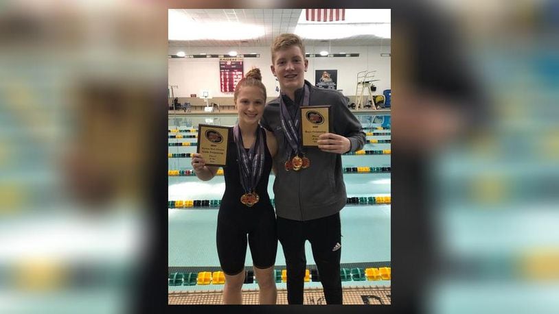 Kenton Ridge High School freshman Evan Blazer, right, and junior Sydney Jones pose for a photo after being named Central Buckeye Conference Kenton Trail Division Swimmer of the Year this season. CONTRIBUTED PHOTO