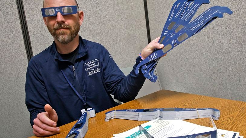 Nate Smith, from the Clark County Combined Health District, wanted everyone to know that the health district has special eclipse glasses that will allow people to view the eclipse safely. They also have literature about viewing the eclipse. BILL LACKEY/STAFF
