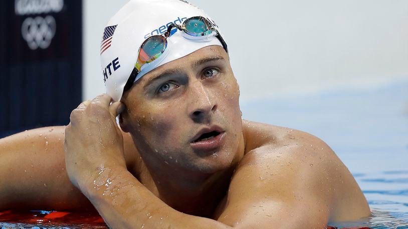 In this Tuesday, Aug. 9, 2016, file photo, United States' Ryan Lochte checks his time in a men's 4x200-meter freestyle heat during the swimming competitions at the 2016 Summer Olympics, in Rio de Janeiro, Brazil.