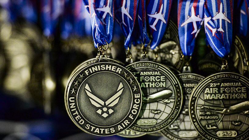 Medals for the 2019 Air Force Marathon hang on display at the race's finish line at Wright-Patterson Air Force Base, Sept. 21, 2019. More than 12,700 runners and 2,600 volunteers from all 50 states and 15 different countries came out to run in the races 23rd year. U.S. AIR FORCE PHOTO/WESLEY FARNSWORTH