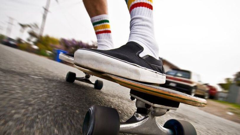 Riding a skateboard while holding a car could become illegal in Ohio