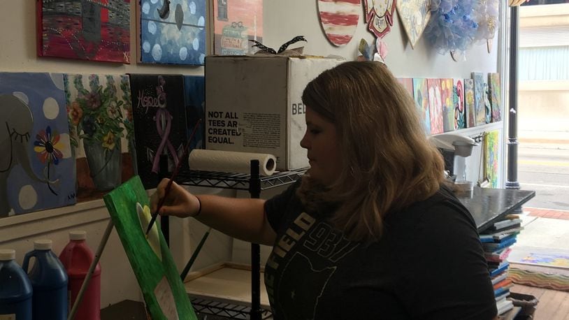 Several events will be held this weekend in Clark and Champaign counties, including a "Galentine's craft room" event held by Sip & Dipity at the Warder Literacy Center in Springfield. Here, Tracey Tackett, owner of Sip and Dipity Paint Bar in Springfield, worked on artwork at her business on Fountain Avenue. STAFF