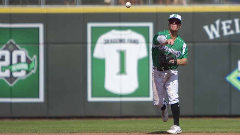 Dragons shortstop Matt McLain throws a runner out at first during Sunday's final game of the season against Fort Wayne at Day Air Ballpark. Jeff Gilbert/CONTRIBUTED