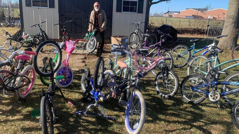 David Nugent with a few of the bikes he has repaired and that are ready for children to ride.