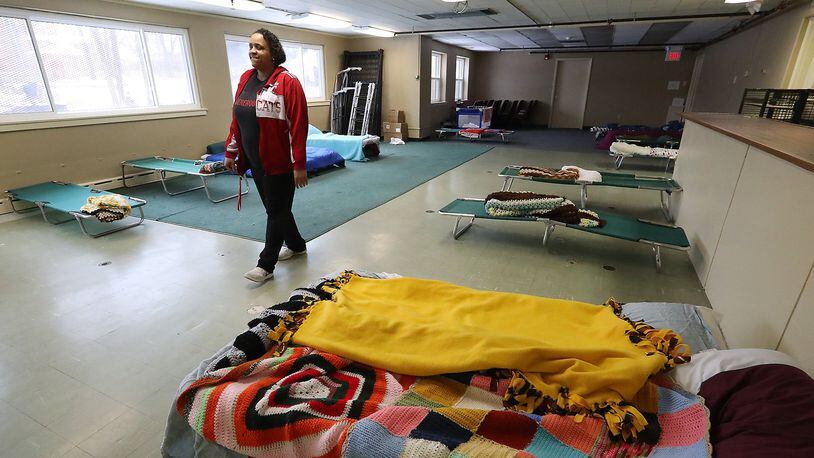 Larina Bias, program manager at Interfaith Hospitality Network, walks through overflow sleeping room at the Network’s Family Shelter. IHN is among Springfield organizations to receive grant from Housing and Urban Development to address homeless. Bill Lackey/Staff
