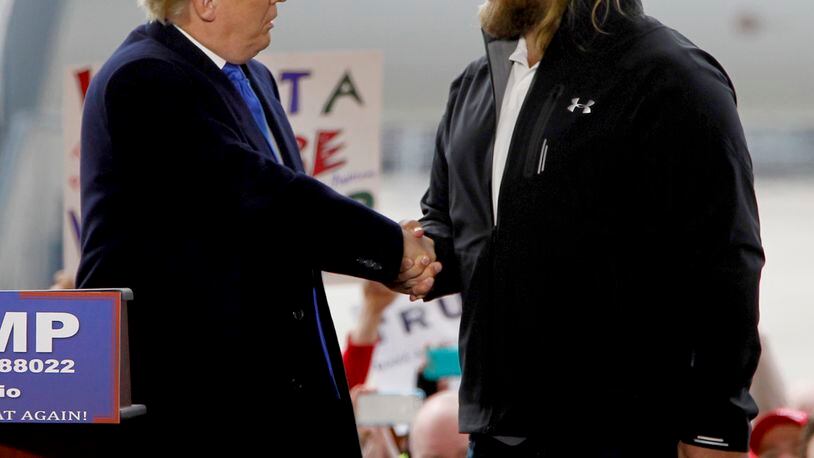 Former Ohio State Buckeye football player Nick Mangold appeared with then-candidate/now President Donald Trump at a rally at Wright Brothers Aero in Vandalia in March 2016. LISA POWELL / STAFF