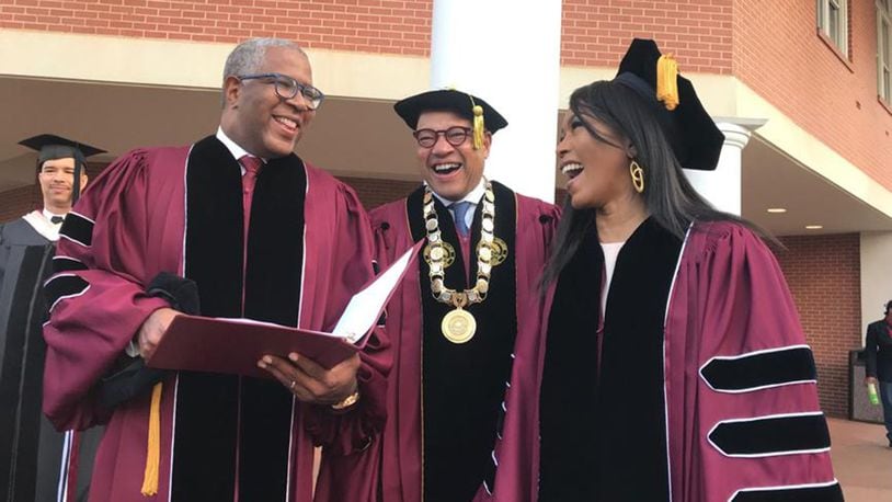 Tech billionaire Robert F. Smith (from left), Morehouse College President David Thomas and actress Angela Bassett prepare to walk to the graduation ceremonies at the college on Sunday, May 19, 2019.  Smith and Bassett  received honorary degrees.