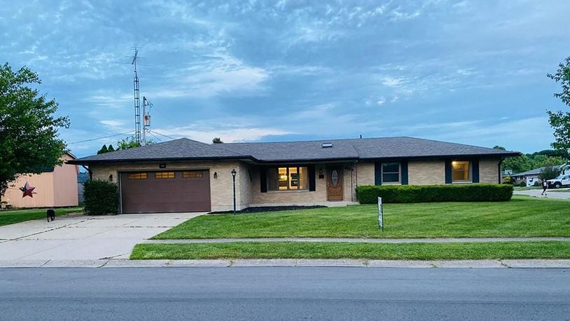 A concrete drive leads to the oversized, 2-car garage of this all-brick ranch home with about 3 bedrooms and about 1,670 sq. ft. of living space. New flooring extends throughout the home. CONTRIBUTED PHOTO