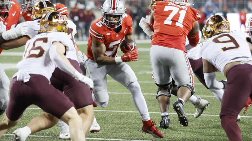 Ohio State running back Dallan Hayden (5) runs the ball against Minnesota during the second half of an NCAA college football game Saturday, Nov. 18, 2023, in Columbus, Ohio. (AP Photo/Jay LaPrete)