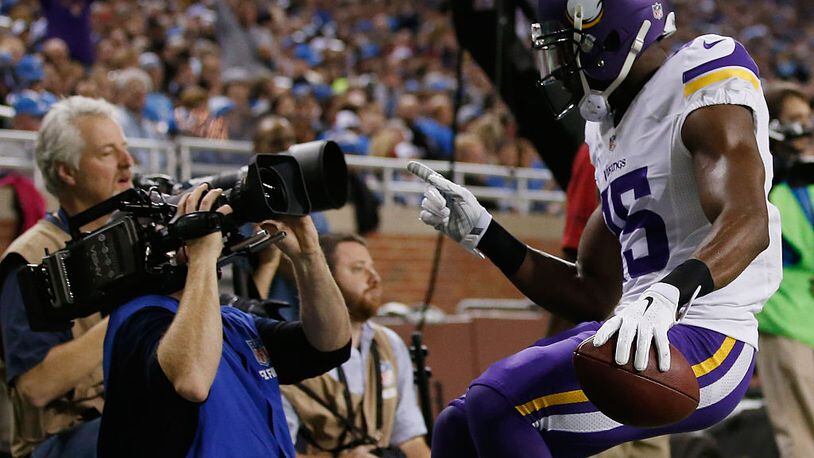 DETROIT, MI - DECEMBER 14: Greg Jennings #15 of the Minnesota Vikings celebrates a second quarter touchdown into a TV camera while playing the Detroit Lions at Ford Field on December 14, 2014 in Detroit, Michigan. (Photo by Gregory Shamus/Getty Images)
