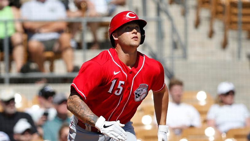 Cincinnati Reds’ Nick Senzel (15) watches his home run during a spring training baseball game against the Chicago White Sox, Monday, March 9, 2020, in Glendale, Ariz. (AP Photo/Sue Ogrocki)