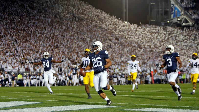 STATE COLLEGE, PA - OCTOBER 21:  Saquon Barkley #26 of the Penn State Nittany Lions rushes for a 69 yard touchdown in the first half against the Michigan Wolverines on October 21, 2017 at Beaver Stadium in State College, Pennsylvania.  (Photo by Justin K. Aller/Getty Images)