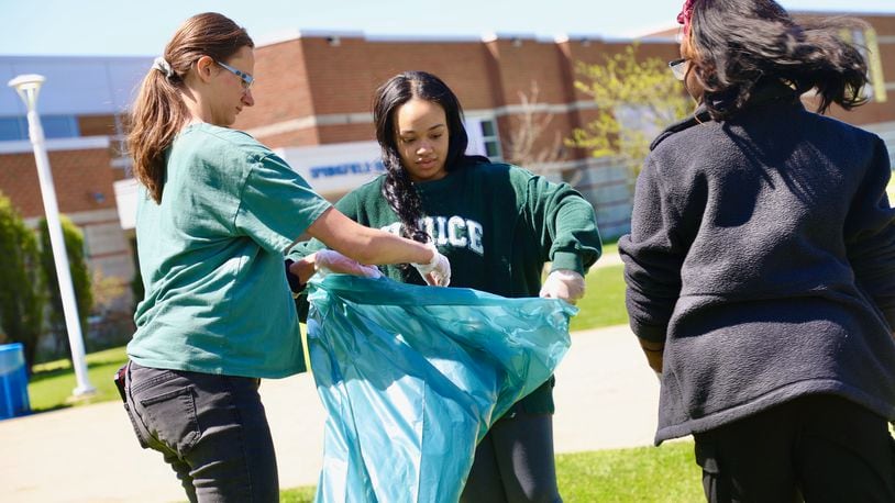 Students in the Springfield City School District observed Earth Day this week, including the High School National Honor Society picking up liter around the campus. Contributed