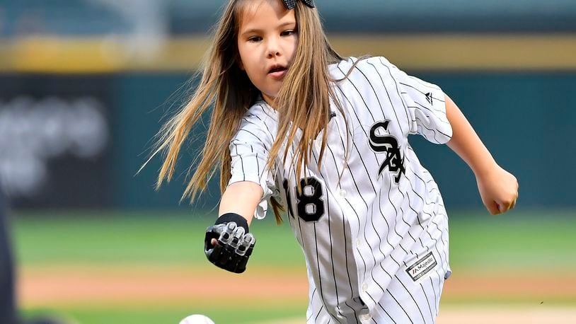 Eight-year-old Hailey Dawson throws the ceremonial first pitch before the game between the Chicago White Sox and the Cleveland Indians on June 12, 2018 at Guaranteed Rate Field in Chicago, Illinois.  (Photo by Quinn Harris/Icon Sportswire via Getty Images)