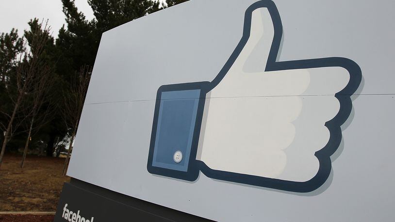 A sign with the “like” symbol stands in front of the Facebook headquarters on February 1, 2012 in Menlo Park, California. (Photo by Justin Sullivan/Getty Images)