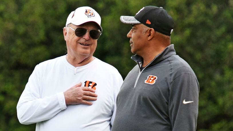 Head coach Marvin Lewis, right, and owner Mike Brown stand on the sideline during rookie camp for the Cincinnati Bengals Friday, May 6 at the practice fields next to Paul Brown Stadium in Cincinnati. NICK GRAHAM/STAFF