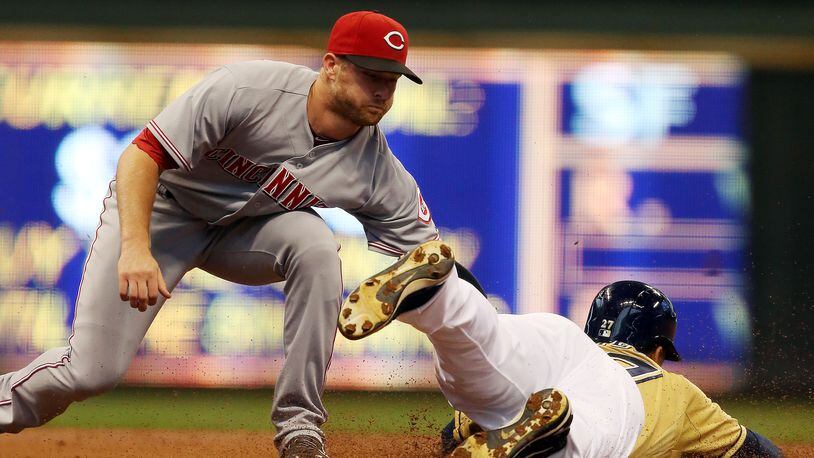 MILWAUKEE, WI - SEPTEMBER 15: Zack Court # 2 of the Cincinnati Reds tags out Carlos Gomez #27 of the Milwaukee Brewers at Miller Park on September 15, 2013 in Milwaukee, Wisconsin (Photo by Tasos Katopodis/Getty Images)