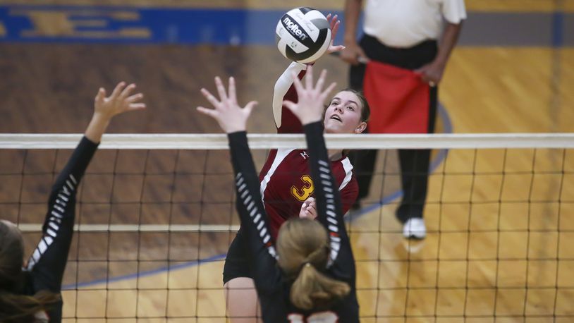 Northeastern High School senior Elizabeth Wiseman jumps to hit the ball during their Division III district semifinal game against Versailles on Tuesday night at Brookville High School. The Tigers won the match 25-22, 25-15, 21-25, 25-22. CONTRIBUTED PHOTO BY MICHAEL COOPER