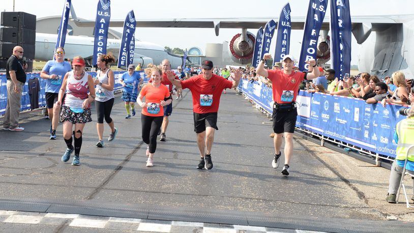 Gen. David L. Goldfein celebrates as he crosses the finish line at the 23rd Air Force Marathon at Wright-Patterson Air Force Base on Saturday. (U.S. Air Force photo by Wesley Farnsworth)