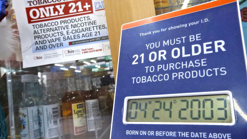Signs on the counter at the Plum Food Mart remind customers that they have to be 21 or older to purchase tobacco or vaping products Wednesday, April 24, 2024. BILL LACKEY/STAFF